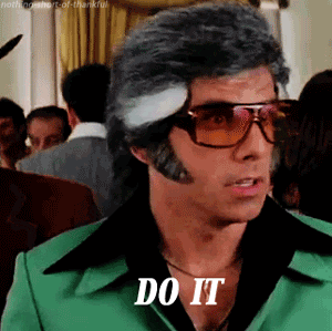Movie gif. Ben Stiller as David in Starsky and Hutch sports a disco look with oversized tortoise shell sunglasses, mutton chops, and a butterfly collar shirt. He looks to the side as he raises his eyebrows and utters, Do it.