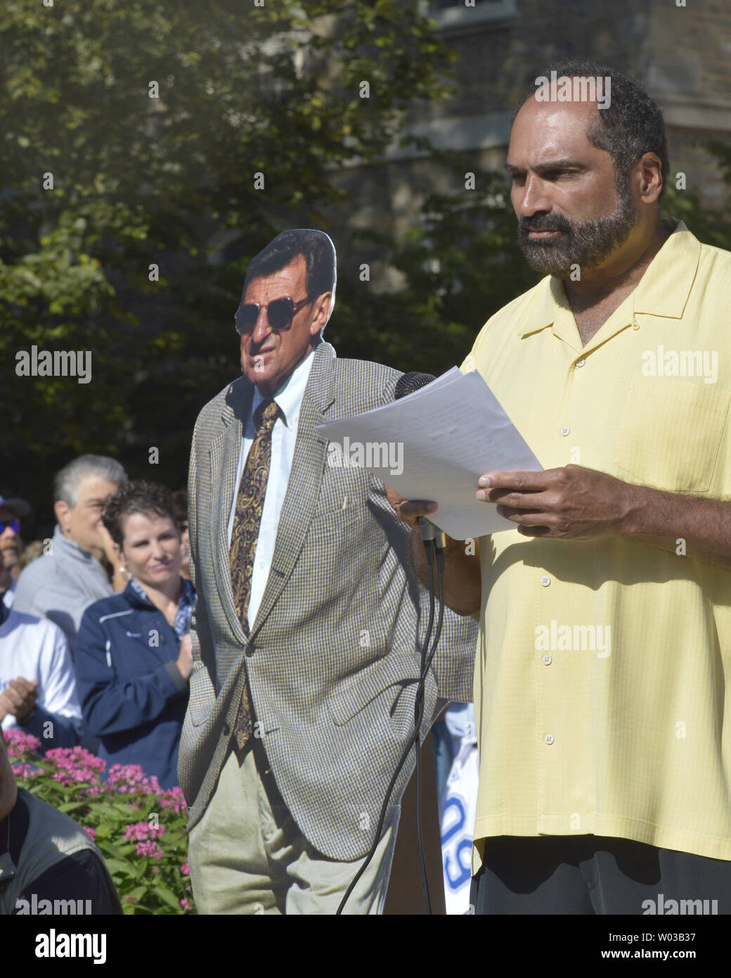 former-pittsburgh-steelers-and-penn-state-alumni-franco-harris-stands-by-a-cardboard-cut-out-of-joe-paterno-as-he-speaks-at-a-rally-calling-for-the-resignation-of-the-universitys-board-of-trustees-in-front-of-old-main-on-the-campus-of-penn-state-in-state-college-pennsylvania-on-september-15-2012-upiarchie-carpenter-W03B37.jpg