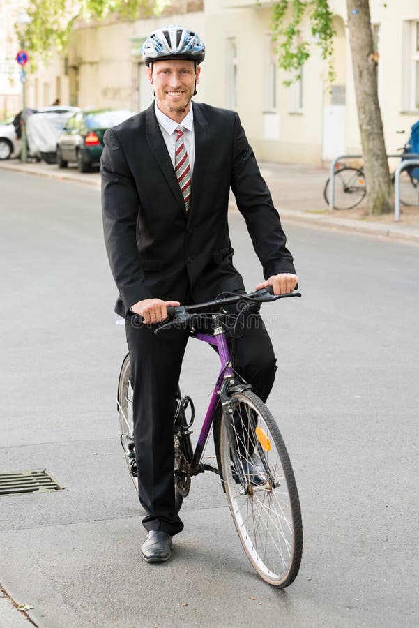 happy-man-suit-riding-bicycle-portrait-businessman-his-54650718.jpg